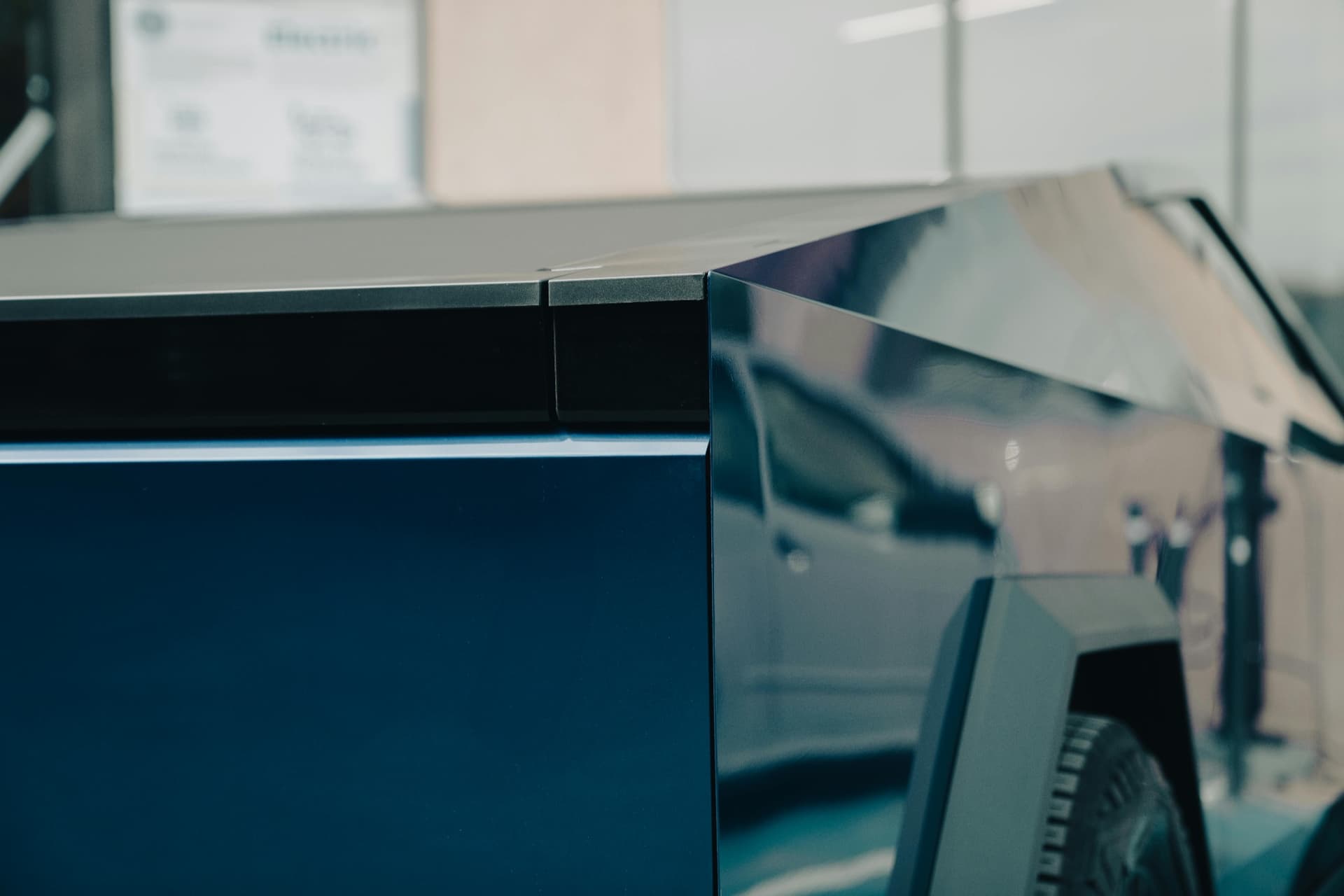 Close-up of custom OZK-fabricated bed enhancements on a Tesla Cybertruck, ready for gear installs.